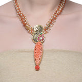 Samyukta Kundan Carved Pink Coral Floral Peacock Necklace Set